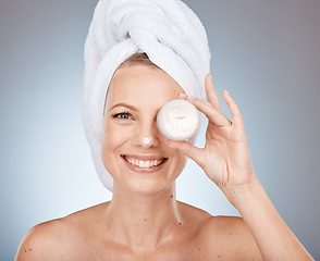 Image showing Skincare, beauty cream and portrait of a woman marketing facial sunscreen, dermatology glow and smile against a grey studio background. Spa product, face wellness and model with lotion for body