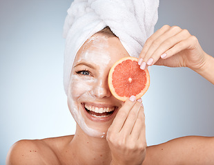 Image showing Skincare, beauty and portrait of woman with grapefruit in studio for natural, organic and healthy skincare products. Wellness, spa and face of girl with fruit for cosmetics, facial mask and treatment