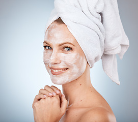 Image showing Portrait, shower and skincare with a model woman in studio on a gray background for facial treatment or hygiene. Face, mask and natural antiaging with an attractive young female in the bathroom