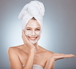 Image showing Woman portrait and face mask after a shower for skincare, beauty and health on a grey studio background. Skin care, mask for glowing skin on a female for cosmetic and dermatology wellness