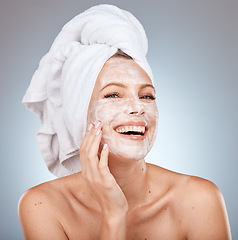 Image showing Skincare, facial cream and woman with mask on gray background studio for wellness, beauty and spa. Dermatology, cosmetics and happy girl with moisturizer, facial mask and skincare products for face