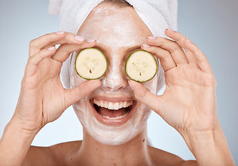 Image showing Spa, facial and woman with cucumber on eyes, fun portrait with cosmetic mask and detox cream. Skincare, beauty and cool face mask on happy model with smile with luxury cleaning skin care product.