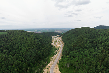 Image showing Aerial top vew of winding road in the mountains