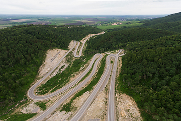 Image showing Aerial top vew of winding road in the mountains