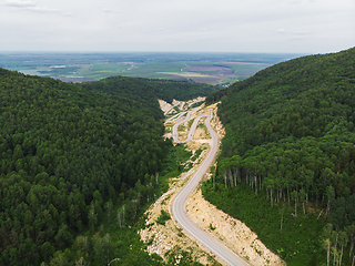 Image showing Aerial top vew of winding road in the mountains