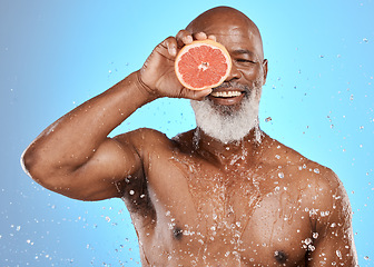 Image showing Beauty, water splash or senior black man with grapefruit for body care, healthcare or skincare health. Happy face, smile or facial portrait of elderly male cleaning, shower or healthy skin wellness