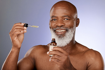 Image showing Portrait, skincare and black man with oil serum cosmetics for acne, wrinkles or anti aging protection in studio. Face, senior or old man marketing an essential oil bottle or natural luxury product