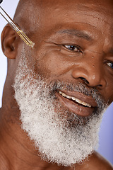 Image showing Skincare, oil and happy, senior and man in studio for facial, wellness and serum product, wrinkles and hydration closeup. Zoom, face and skin, hyaluronic acid or retinol for elderly man beauty