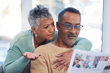 Image showing Couple, shocked or confused in book reading, magazine or travel newsletter in vacation planning, holiday ideas or break location. Mature woman, Indian man and hug with article or print media in house
