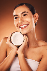 Image showing Beauty, coconut and skincare, woman with natural and diy facial product for face, body and skin against studio background. Fruit, detox and healthy cosmetic with wellness and sustainable cosmetics.