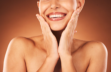 Image showing Beauty, skincare and teeth, woman hands touching face for facial and cosmetics against studio background. Dental, lips and teeth whitening with veneers, wellness and cosmetic treatment with botox.