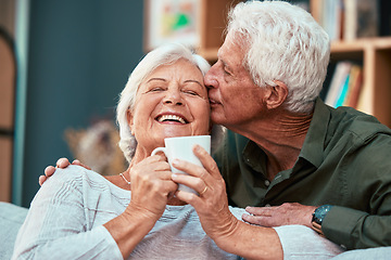 Image showing Coffee kiss, love and senior couple smile for retirement, conversation and relax in the living room of a house. Home tea, affection and elderly man and woman with comic communication in the lounge