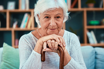 Image showing Thinking, cane and retirement with a senior woman sitting on a sofa in the living room of her home alone. Idea, disability and walking stick with a mature female pensioner in her house to relax