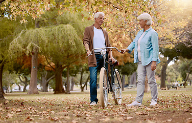 Image showing Senior couple, bonding or bicycle learning in countryside nature, public park or garden on love date, experience or opportunity. Retirement elderly, man or woman with bike for relax transport travel