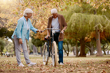 Image showing Senior couple, walking and bike in nature park together for romace date, quality time and relax freedom outdoor. Love, support care and summer walk for retirement, happy man and woman with bicycle