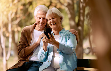 Image showing Relax, happy and phone with old couple in park for video call, social media and communication. Smile, health and internet with man and woman on bench in nature for retirement, 5g and technology