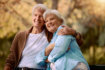 Image showing Elderly, couple hug in the park with love and happy in retirement, outdoor in nature, calm and peace with view. Senior man with woman, smile and support, embrace and bonding in Boston public garden.