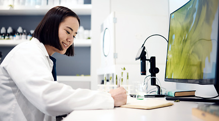 Image showing Scientist, planning and asian woman working in lab for research innovation, writing results or science analytics at desk. Laboratory, forensic biology and happy medical physician write report notes