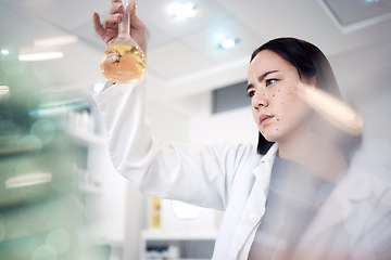 Image showing Scientist, medical research and thinking while holding chemical in beaker for analytics, solution and virus test in science laboratory. Asian woman doctor with medicine for healthcare and chemistry