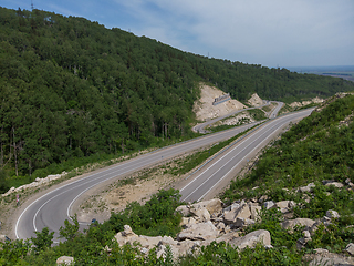 Image showing Aerial top vew of winding road in the mountains