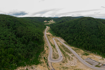 Image showing Aerial top vew of winding road in the mountains