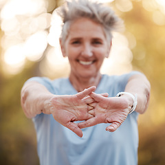 Image showing Senior woman, runner stretching hands in park for running, exercise or wellness with smile. Elderly female training, muscle health and warm up for workout, self care and healthy development outdoor