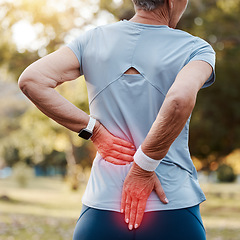 Image showing Senior woman with back pain, injury or accident while running at outdoor park for cardio workout. Nature, emergency and elderly female runner with spine inflammation, injured muscle or sprain joint.