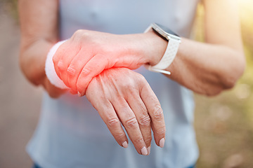 Image showing Woman, wrist pain and red injury on sports workout, wellness exercise and health training in forest. Zoom on hands, fitness strain and medical emergency or burnout accident in outdoor nature workout