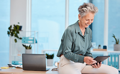 Image showing Senior, business woman and tablet in office for social media, internet browsing or research. Happy, elderly and female employee from Canada with digital touchscreen for networking or web scrolling.