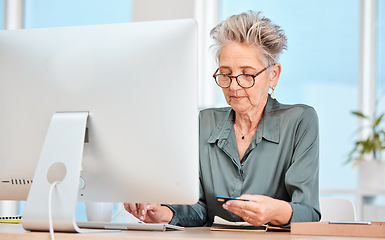 Image showing Business woman, credit card and computer with banking, online shopping and payment for bills on internet in a office. Senior woman, ecommerce and transfer money on pc at desk at her job and web app