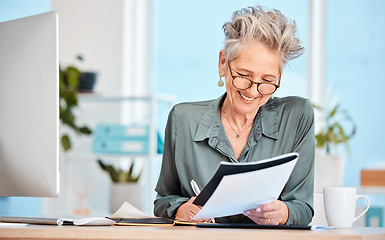Image showing Finance paper, working and business woman writing notes in office, sitting at desk. Ideas, vision or senior woman with pen in hand to write, smile or paperwork, document and financial budget at desk