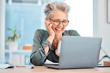 Image showing Laptop, coffee and senior business woman laughing at an email in her office at work for fun or humor. Computer, tea and comic with a mature female employee working on a report or project and joking