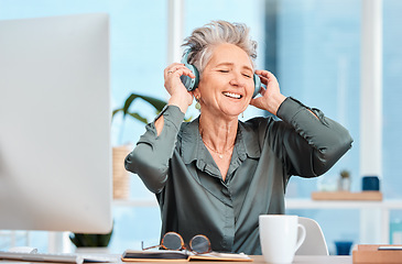 Image showing Office music, relax and business woman with audio headphones, podcast and streaming radio in an office at work. Worker freedom, corporate smile and senior employee listening to a song on company wifi