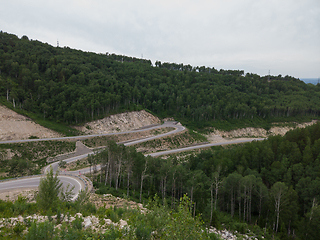 Image showing Aerial top vew of winding road in the mountains