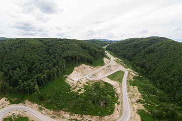 Image showing Aerial top vew of winding road in the mountains