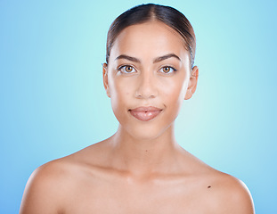 Image showing Beauty, face and skin with woman in makeup portrait, skincare, facial and treatment for wellness with blue studio background. Natural cosmetics, clean look cosmetic and glow with dermatology mockup.