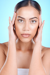 Image showing Woman, skincare or touching face with hands on blue background in studio for dermatology self love, anti aging treatment or collagen. Facial portrait, Brazilian beauty model or eyes makeup cosmetics