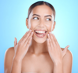 Image showing Face, hands and woman tongue for skincare beauty wellness, luxury spa dermatology or natural cosmetics makeup. Facial care, self care body glow and happiness for skin or body care in blue studio