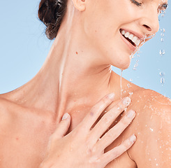 Image showing Woman, skincare and happy in shower for beauty wellness, body hygiene and salon spa cleaning. Model, smile and luxury cosmetics care and natural dermatology with water in blue background studio
