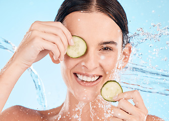 Image showing Water splash, cucumber and beauty woman portrait of a model feeling happy about natural skincare. Cosmetic, organic facial dermatology and nutrition of a person with happiness from face cleaning