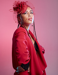 Image showing Woman, red fashion and edgy portrait, trendy and vintage wear in studio. Punk model, funky rock metal or retro style 90s clothes and modern, creative designer or stylish aesthetic in pink background