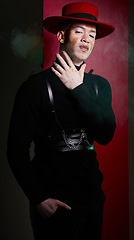 Image showing Fashion, stylish and portrait of man model posing in studio with luxury, trendy and fancy outfit. Elegant, style and guy with vitiligo with modern, edgy and cool clothes by red and black background.