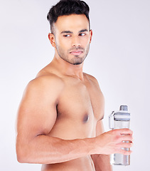 Image showing Fit, strong and workout break and water bottle with a man ready to drink water on a grey studio background. Bodybuilder, drinking water and exercise or training break for thirsty hydration