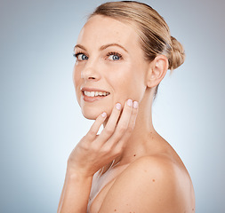 Image showing Beauty, wellness and portrait of a woman in studio with health, cosmetic and natural skincare routine. Makeup, face and model from Australia with skin or facial treatment isolated by gray background.