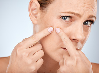 Image showing Health, skincare and woman squeeze acne in face with studio background. Skin care, morning facial and lady with flaws, blemish and imperfection pop pimple or blackhead with fingers and hands.