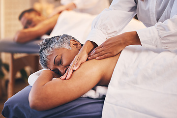 Image showing Massage, spa and woman enjoying a body treatment with her husband to relax, rest and be calm. Beauty, bodycare and luxury routine with a massage therapist in a beauty spa treating a mature female