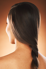 Image showing Back, hair care and woman with natural beauty, cosmetics or hairstyle against brown studio background. Rear view, young female and girl with straight, trendy look or confident for treatment or relax