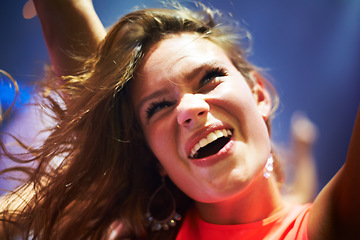 Image showing Dance, music and happy with woman at concert for party, nightclub and festival dj event. Disco, rock and freedom with girl dancing in crowd of fans for celebration, energy and techno performance