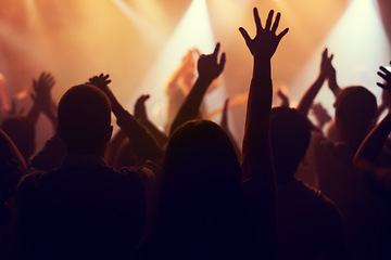 Image showing Music, lights and hands of crowd at concert for party, disco and live band performance. Dance, nightclub and silhouette of audience listening to artist on stage at festival for energy, rave and event