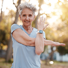 Image showing Portrait, fitness and stretching with a senior woman athlete doing a warm up for exercise or training. Park, nature and workout with a mature female getting ready for cardio or endurance in summer